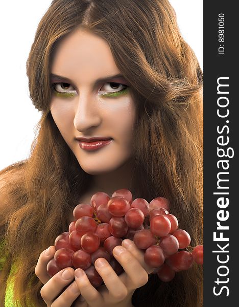 Portrait of young girl witn  dark grapes