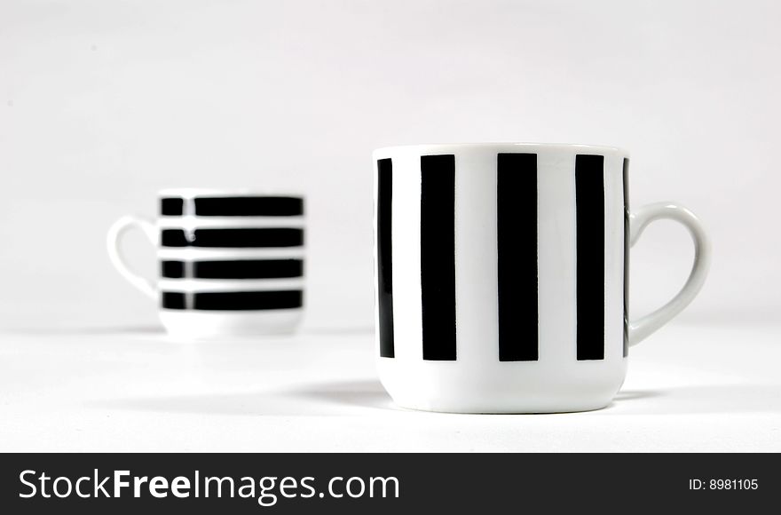 Black and white cups of coffe