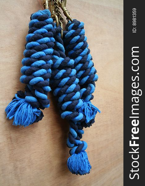 Three coils of knotted blue striped rope