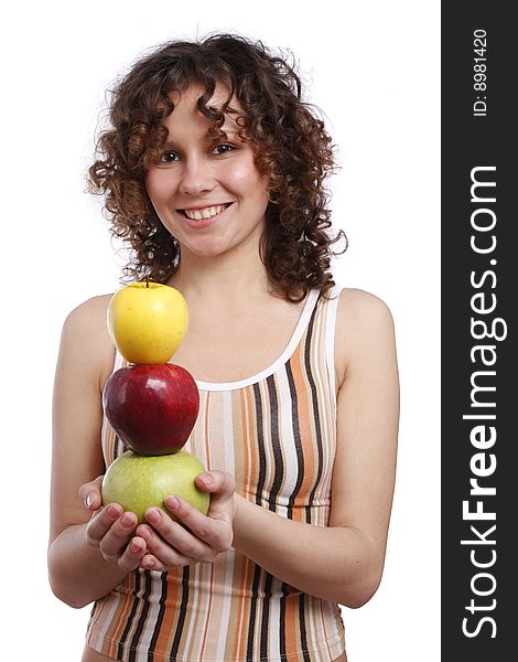 Young smiling woman with three apples. Attractive girl is holding the pyramid of apples. Isolated over white. Young smiling woman with three apples. Attractive girl is holding the pyramid of apples. Isolated over white.