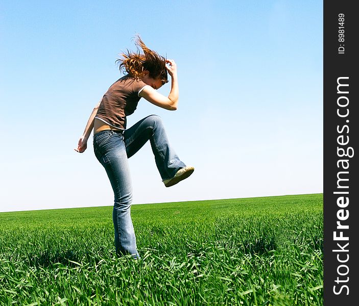 Jumping girl on natural background