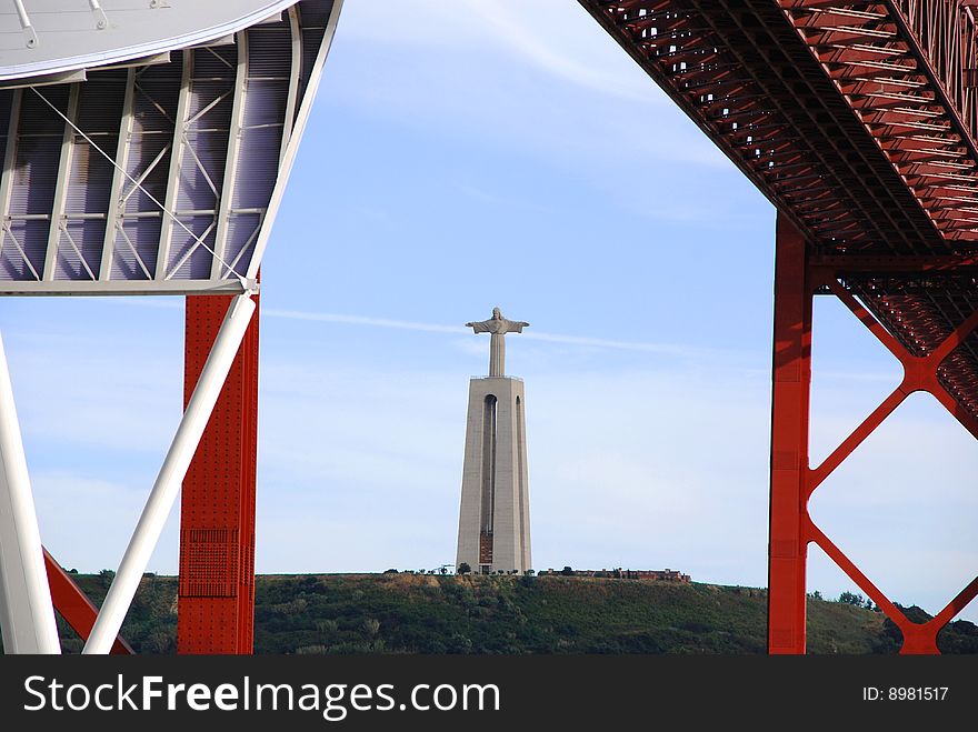 Image of the Christ Rei statue, symbol of Lisbon, from the famous 25 April Bridge. Image of the Christ Rei statue, symbol of Lisbon, from the famous 25 April Bridge.