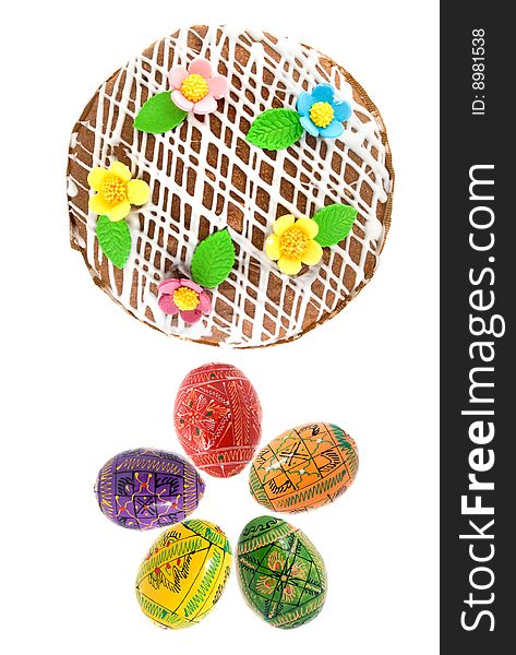 Easter eggs and cake isolated on white