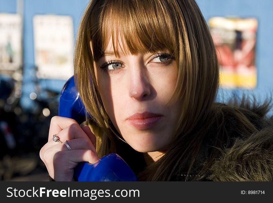 Young Attractive Blonde Female on Pay Phone