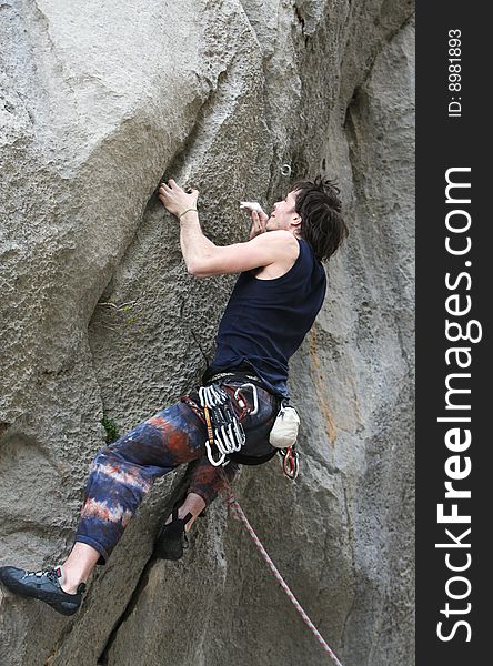 Climber in action in overhanging rock