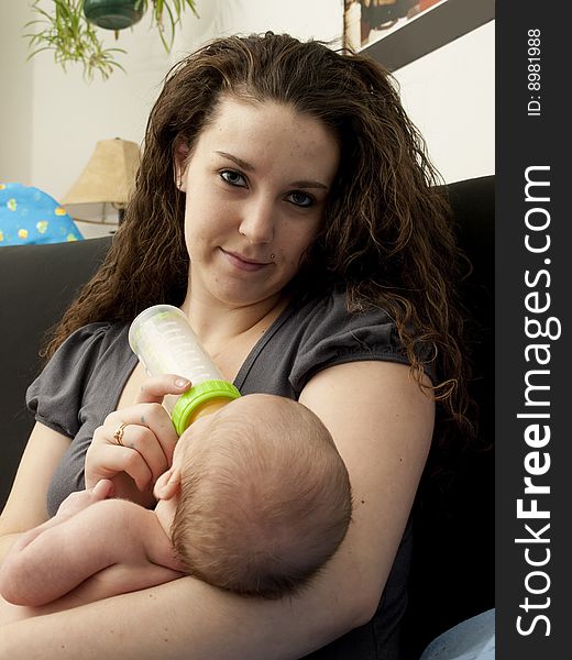 Newborn baby boy being bottle-fed by hs mother. Newborn baby boy being bottle-fed by hs mother