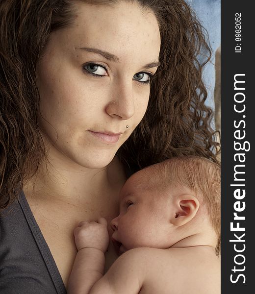 Newborn baby boy resting on mom's chest. Newborn baby boy resting on mom's chest