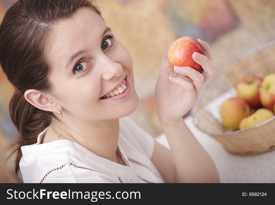 A photo of young girl eating an apple. A photo of young girl eating an apple