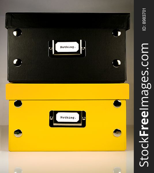 Black and Yellow office boxes sitting on each other with Nothing. label on front panel. Black and Yellow office boxes sitting on each other with Nothing. label on front panel.