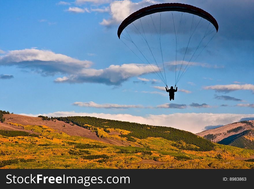 Paraglider views the fall colors from above. Paraglider views the fall colors from above.