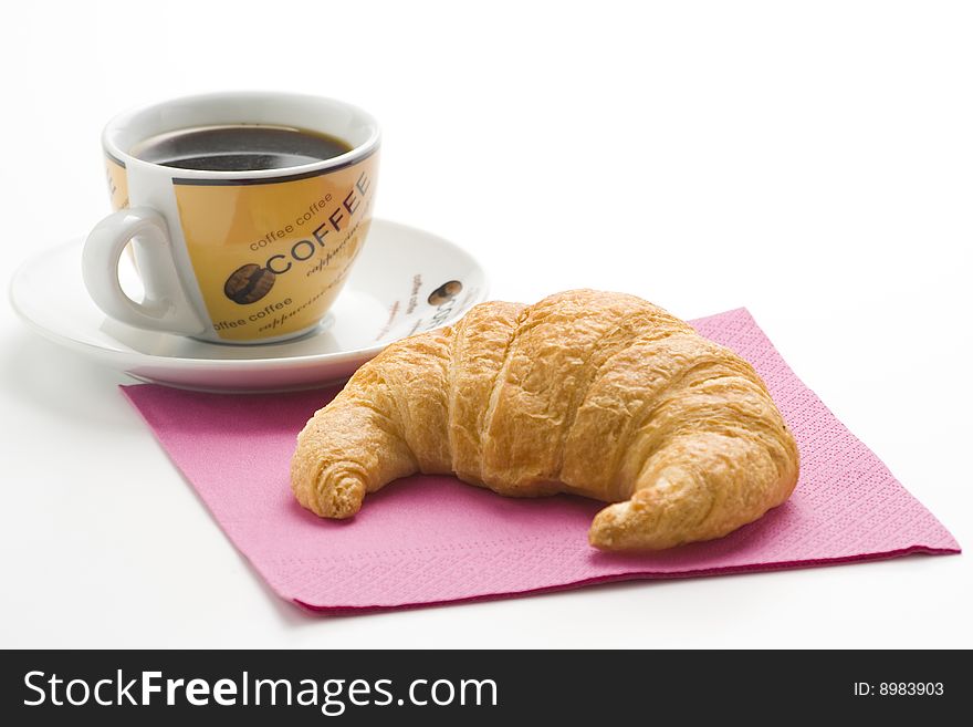 Delicious continental breakfast of coffee and croissants isolated