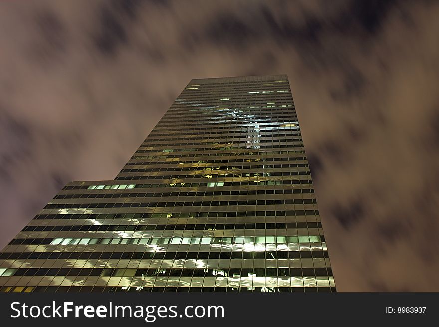 Night view of Los Angeles skyscrapers and cloudy sky