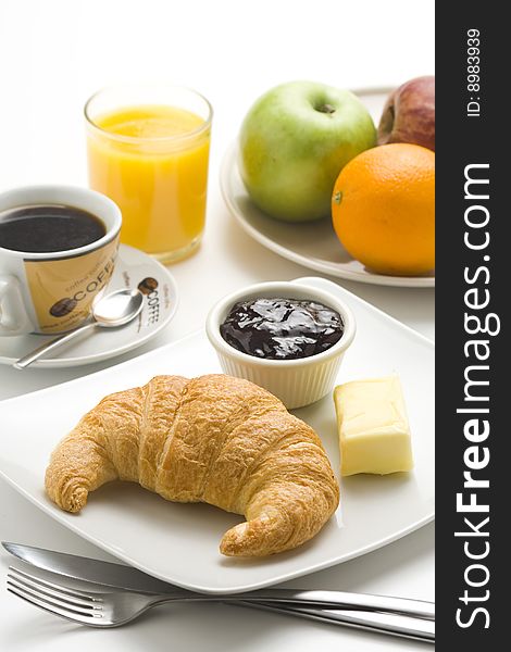 Delicious continental breakfast of coffee and croissants isolated