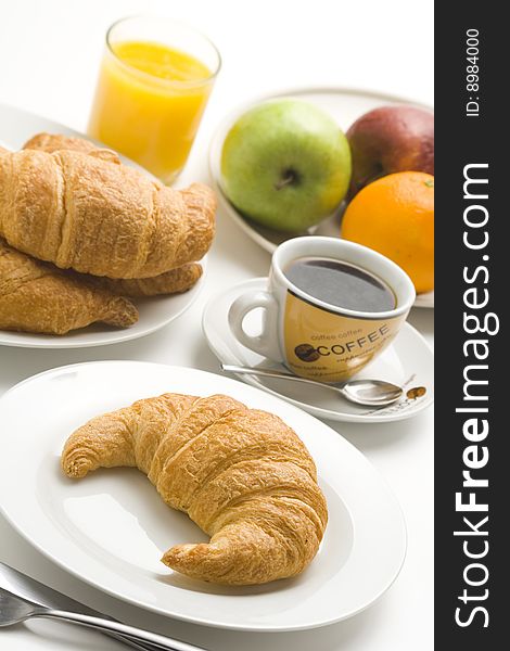 Continental breakfast of coffee and croissants