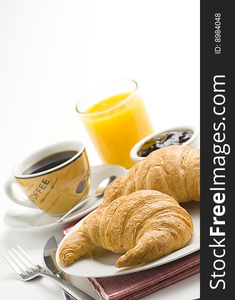 Continental Breakfast Of Coffee And Croissants