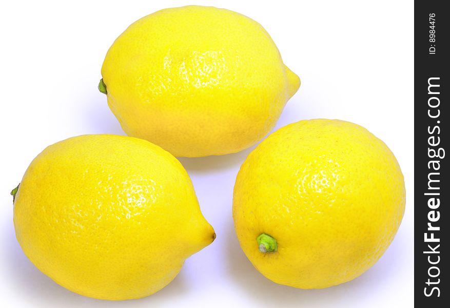 Group of three yellow lemons isolated over white with clipping path