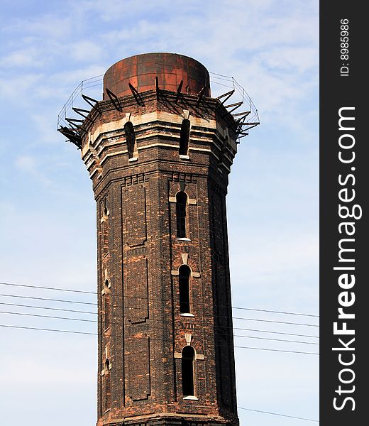 Old red brick water tower built in 19th century