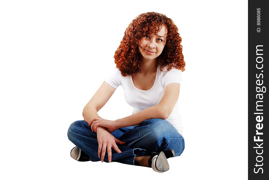 Girl in blue jeans and white T-shirt on a white background