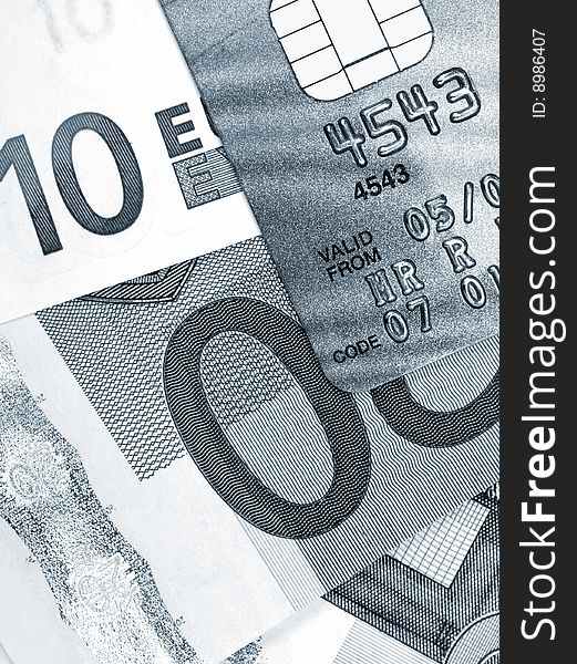 Close-up of credit card resting on Euro bank notes. Close-up of credit card resting on Euro bank notes