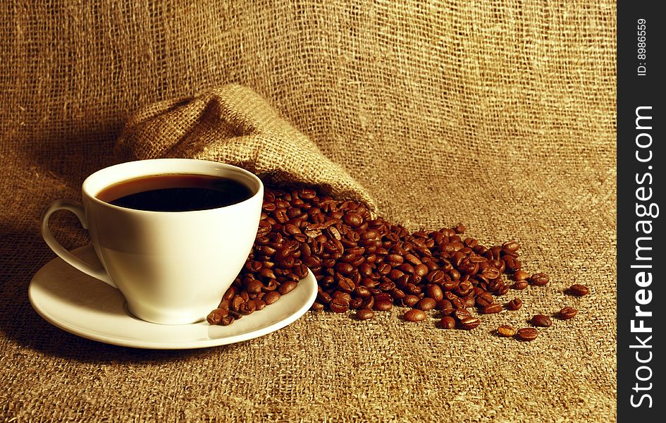 Cup of coffee at the textile background. Cup of coffee at the textile background