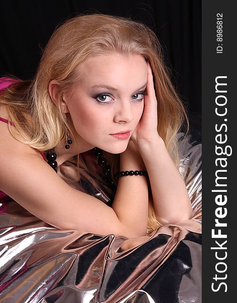 Beautiful blond fashion model posing in studio. Beautiful blond fashion model posing in studio