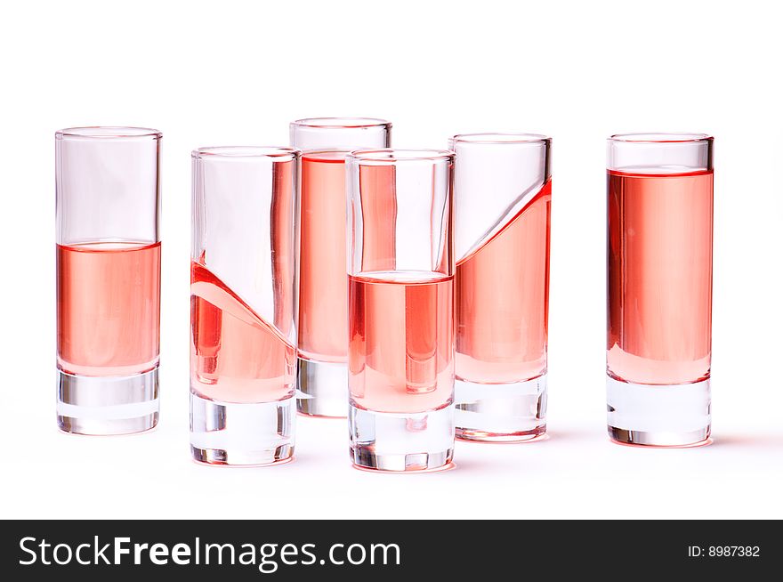 Thin glasses with pink liquid