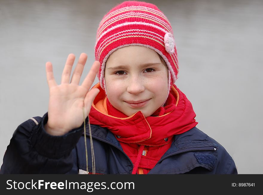 Portrait of cheerful girl on grey background. Portrait of cheerful girl on grey background