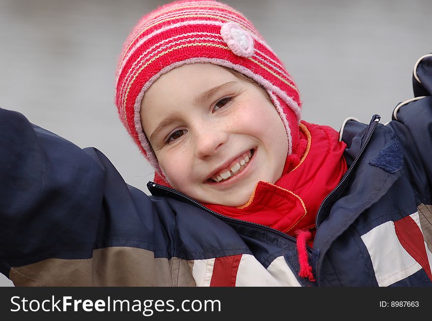 Portrait of cheerful girl on grey background. Portrait of cheerful girl on grey background