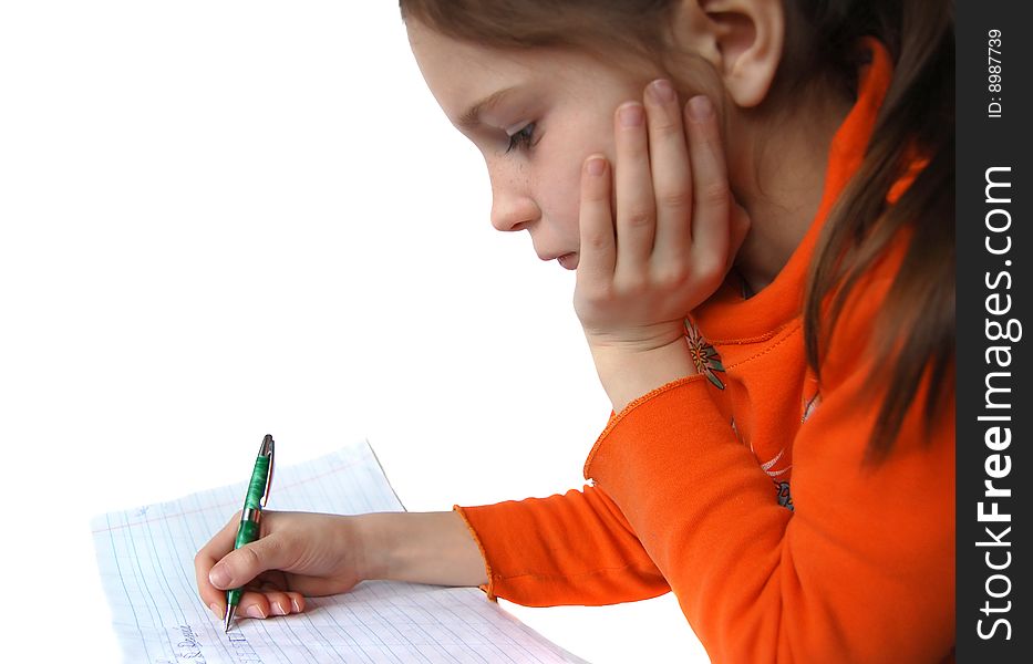 Portrait of girl writing in notebook