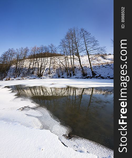 Winter lanscape with frozen river