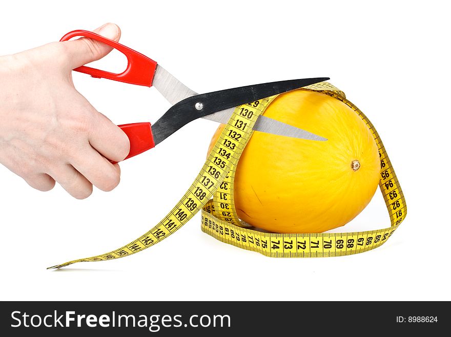 Melon, scissors and measuring tape. Close up. Melon, scissors and measuring tape. Close up