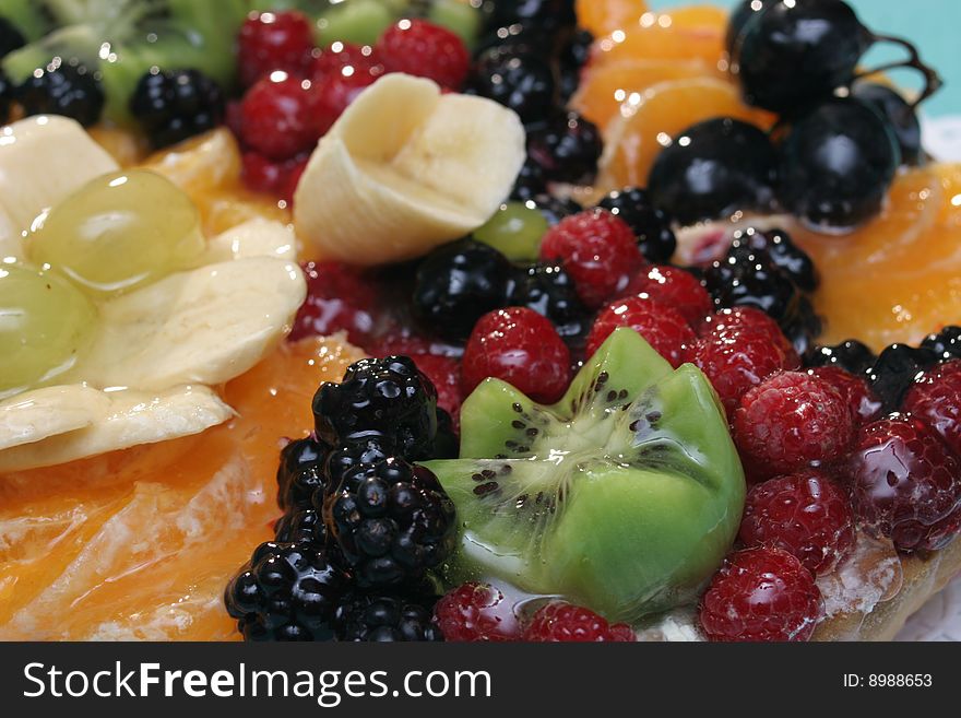 Delicious cake with fruits close up