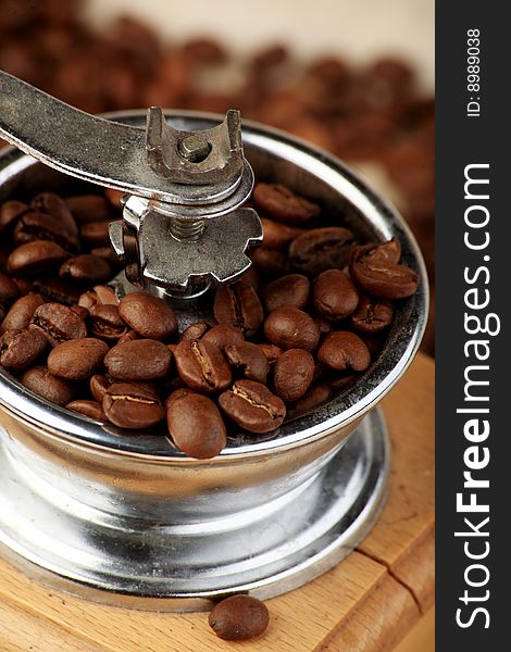 Coffee background: Close-up of a beans cup, mill. Coffee background: Close-up of a beans cup, mill