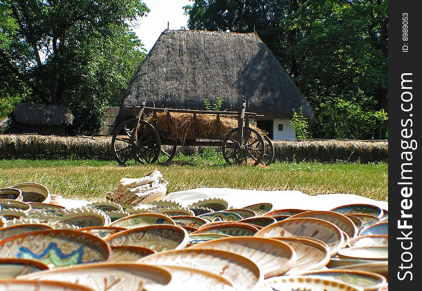 Old house with a cart in front.