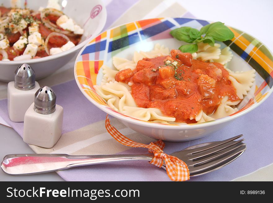 A fresh meal of italian pasta with salad. A fresh meal of italian pasta with salad