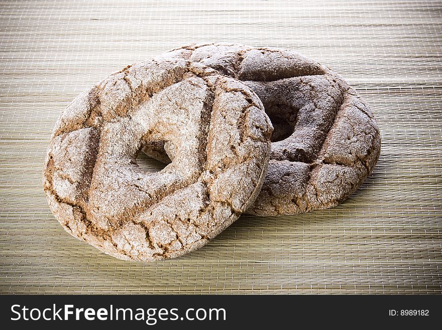 Fresh round rye bread on table