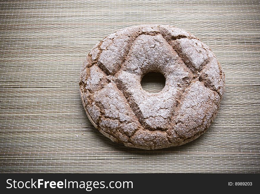 Fresh round rye bread on table