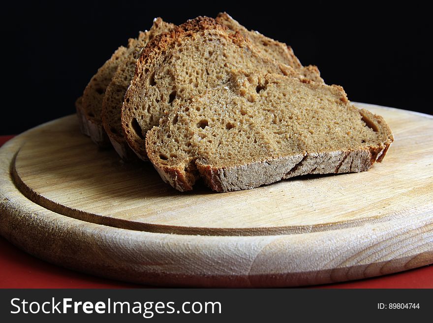 Brown Bread on Round Wooden Tray