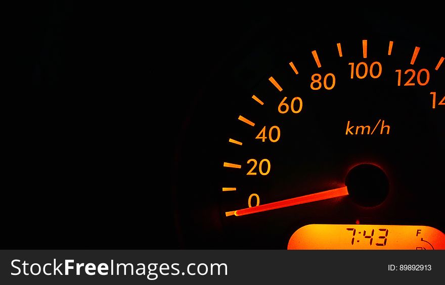 Close up of automotive speedometer gauge measured in kilometers per hour.