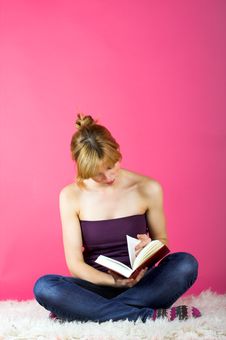 Young Woman Reading A Book Stock Photography