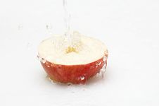 Fresh Water Falling On An Apple. Royalty Free Stock Images
