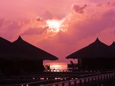 Human Silhouette In Water Bungalow At Sunset Royalty Free Stock Photography Human Silhouette In Water Bungalow At Sunset Royalty Free Stock Photography