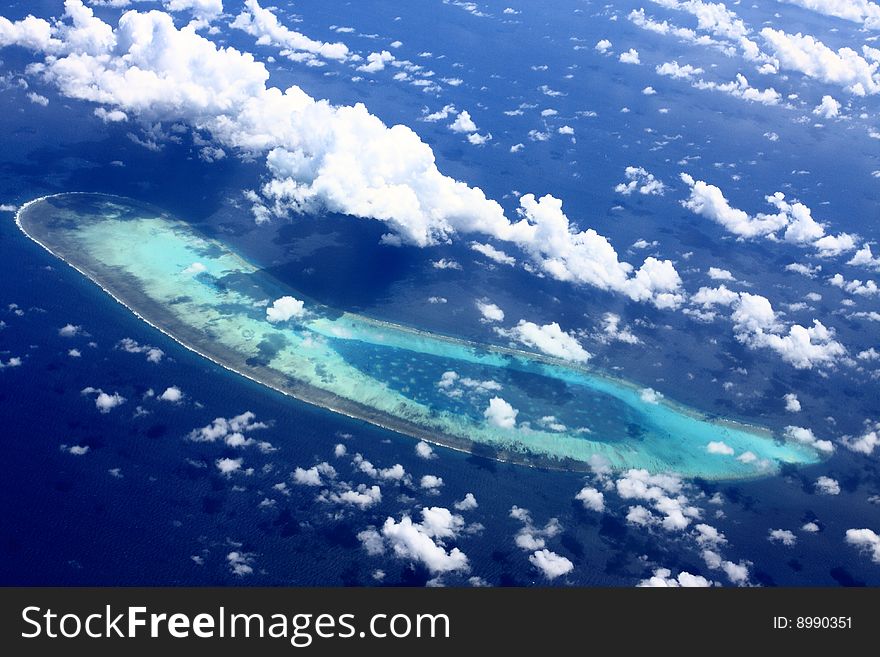 Blue sky, blue ocean, and coralline island in western pacific ocean. Blue sky, blue ocean, and coralline island in western pacific ocean