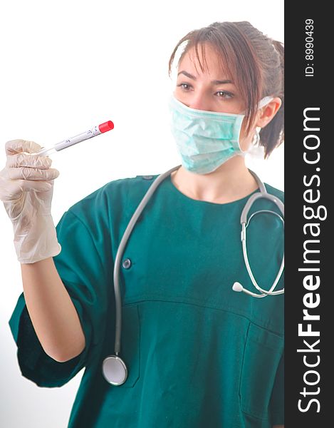 Female doctor checking the bio sample from the medical tube. Female doctor checking the bio sample from the medical tube