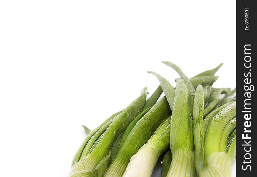 Young, fresh, green onions, for cookery on a white background