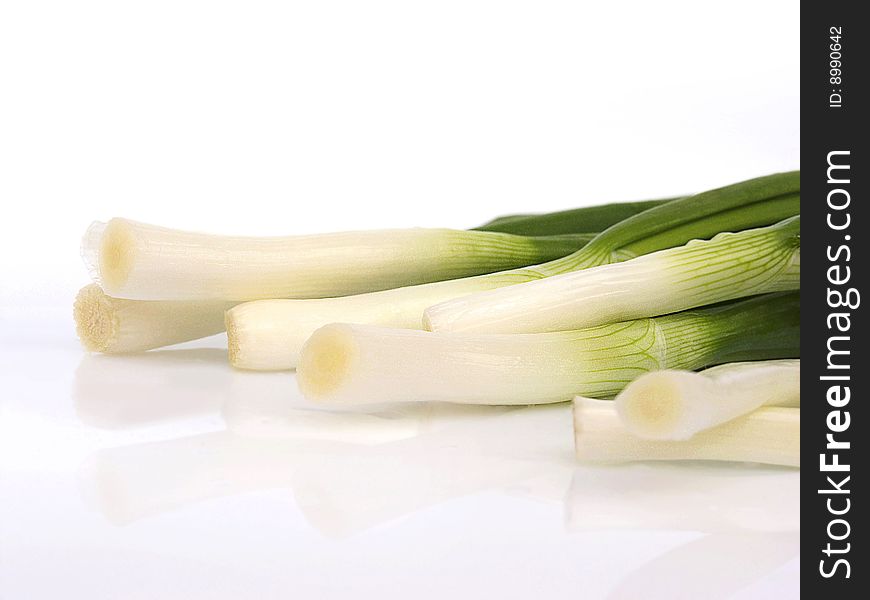 Young, fresh, green onions, for cookery on a white background