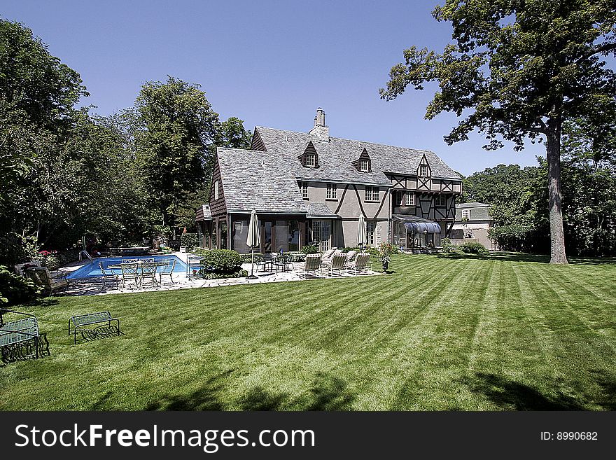 Luxury home with large lawn and swimming pool. Luxury home with large lawn and swimming pool