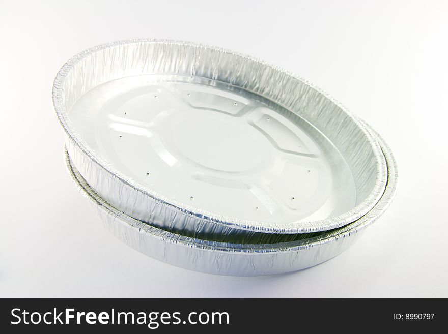 Two round high sided catering trays on a white background. Two round high sided catering trays on a white background