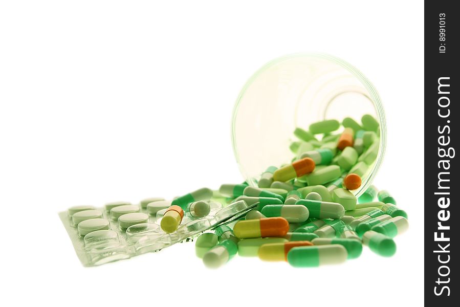 Green Pills On A White