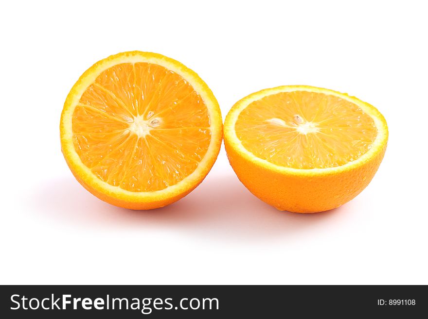 An orange cut into half isolated on white background.